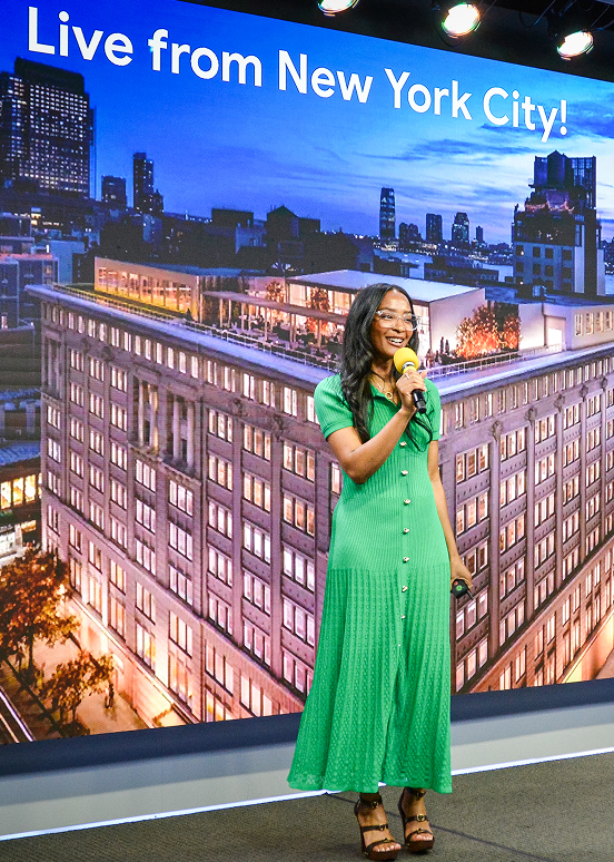 A woman hosting an event.